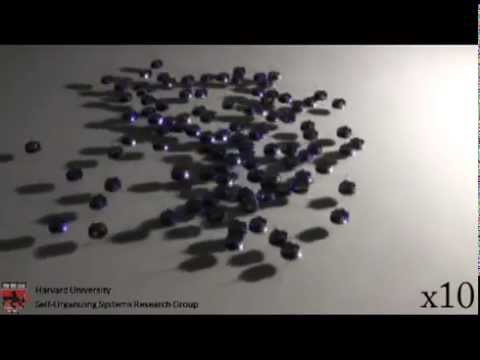 100 Kilobots Robotic Swarm - Swarm Moves Towards a light Source at Harward